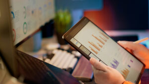 a person looking at analytics data on an ipad