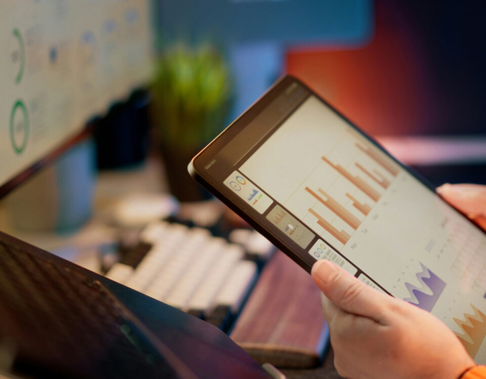 a person looking at analytics data on an ipad